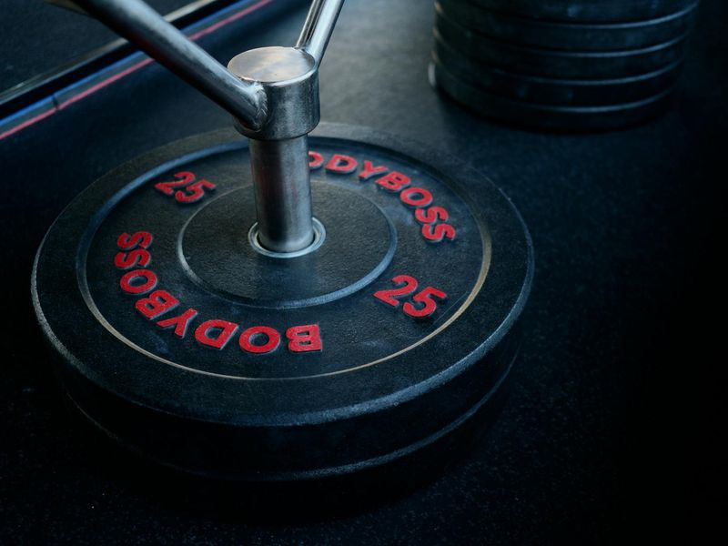 Detailed close-up of gym equipment and weights for training.